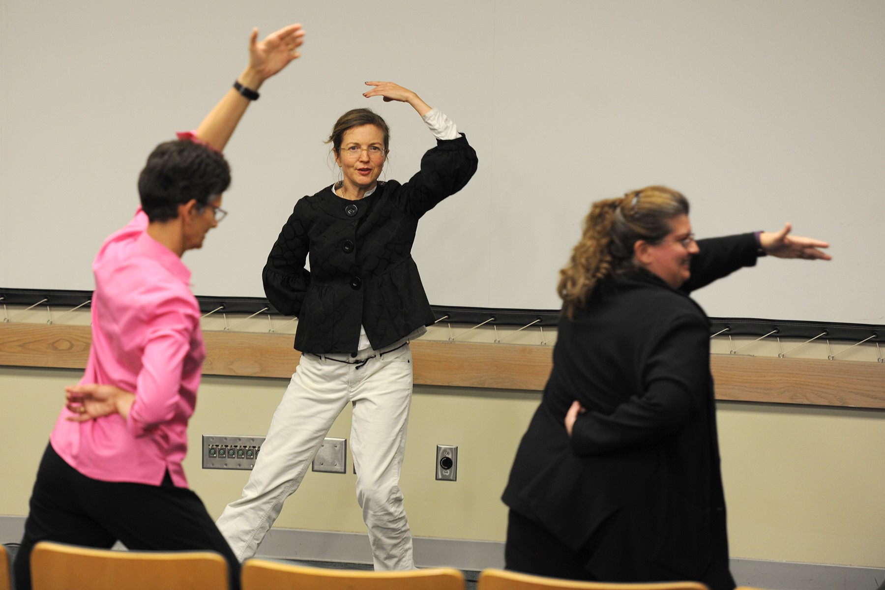 Wellness Warrior Award recipient, Dr. Elizabeth Strand (center), leading a Tai Chi session. 