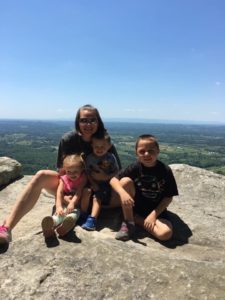 Kimberly Cox, May Wellness Warrior Award Winner, at the top of House Mountain with her Kids. 